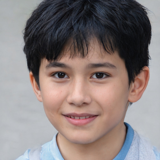 Joyful white child male with short  brown hair and brown eyes