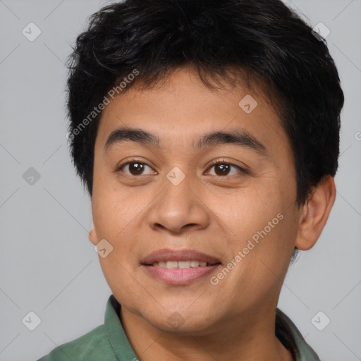 Joyful asian young-adult male with short  brown hair and brown eyes