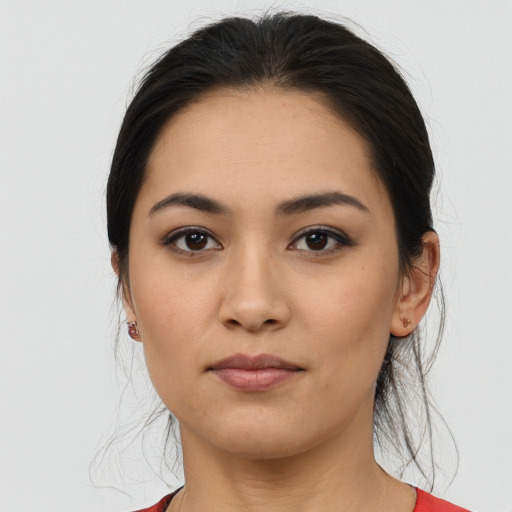 Joyful asian young-adult female with medium  brown hair and brown eyes