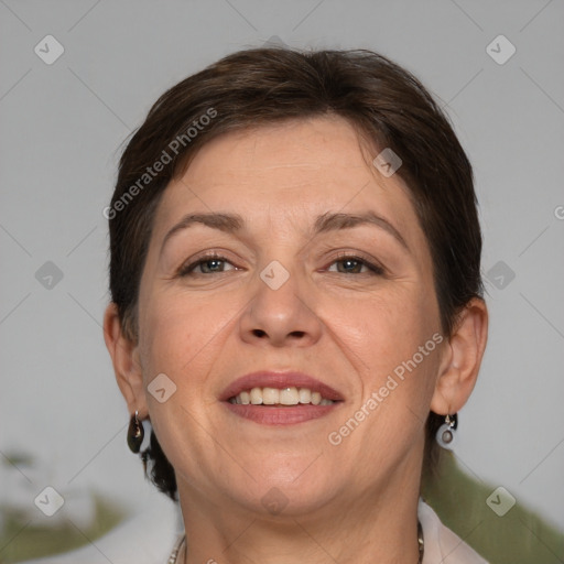 Joyful white adult female with medium  brown hair and brown eyes