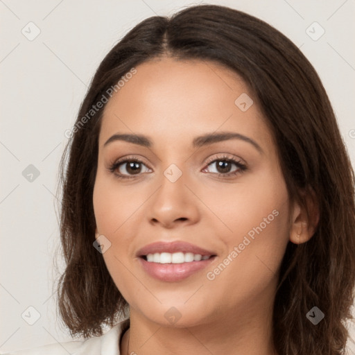 Joyful white young-adult female with long  brown hair and brown eyes