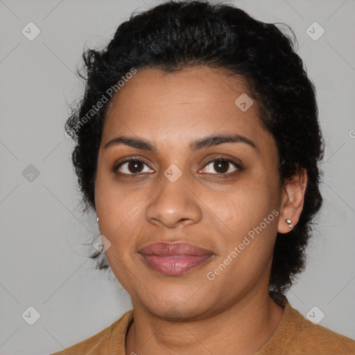 Joyful black young-adult female with medium  black hair and brown eyes