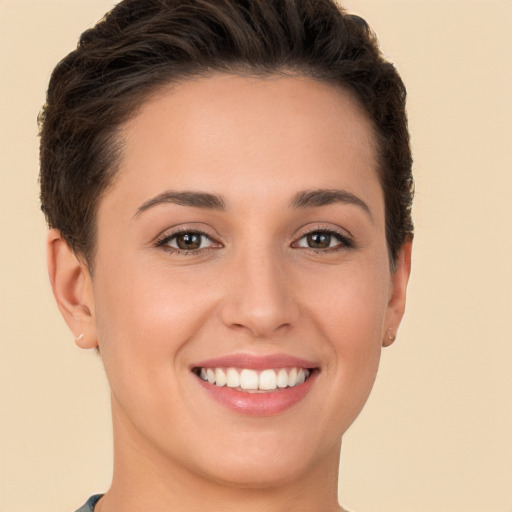 Joyful white young-adult female with short  brown hair and brown eyes