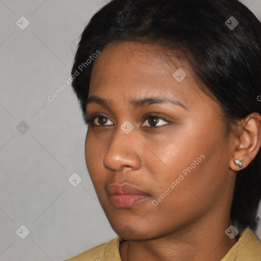 Neutral black young-adult female with short  black hair and brown eyes