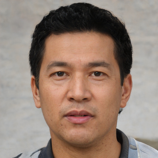 Neutral asian adult male with short  black hair and brown eyes