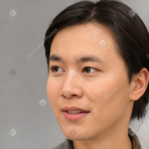 Joyful asian young-adult male with medium  brown hair and brown eyes