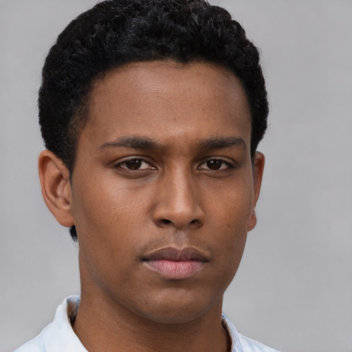 Neutral latino young-adult male with short  brown hair and brown eyes