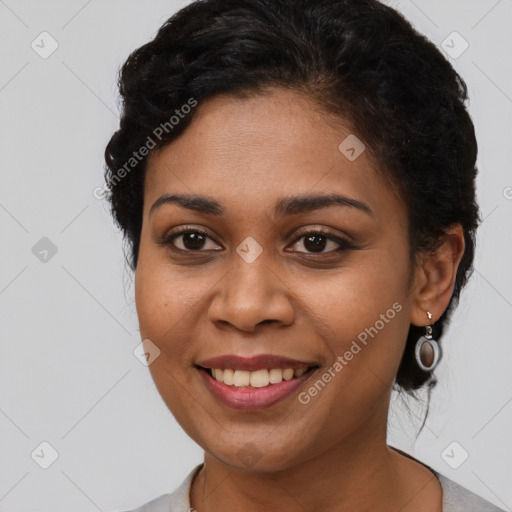 Joyful latino young-adult female with long  brown hair and brown eyes