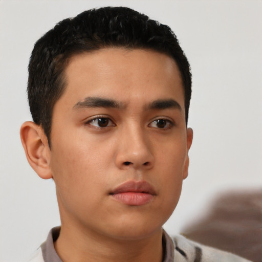 Neutral latino young-adult male with short  black hair and brown eyes
