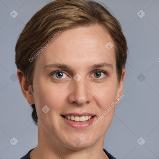 Joyful white young-adult female with short  brown hair and grey eyes