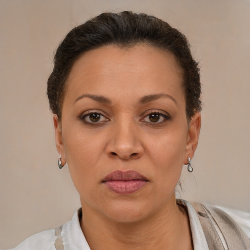 Neutral latino adult female with short  brown hair and brown eyes