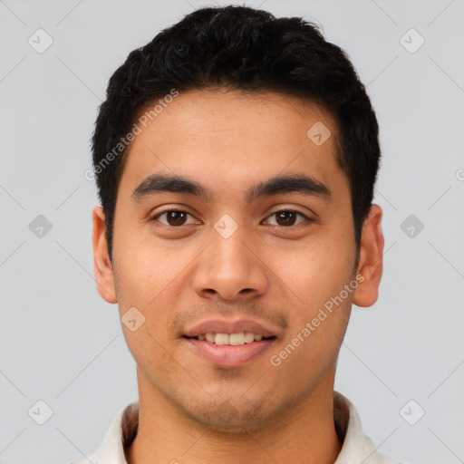 Joyful latino young-adult male with short  brown hair and brown eyes