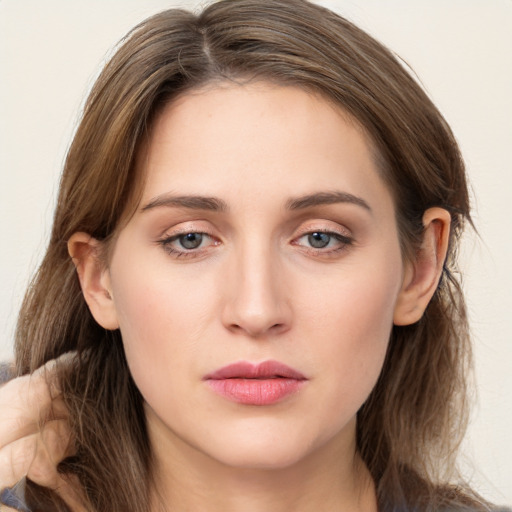 Neutral white young-adult female with long  brown hair and grey eyes