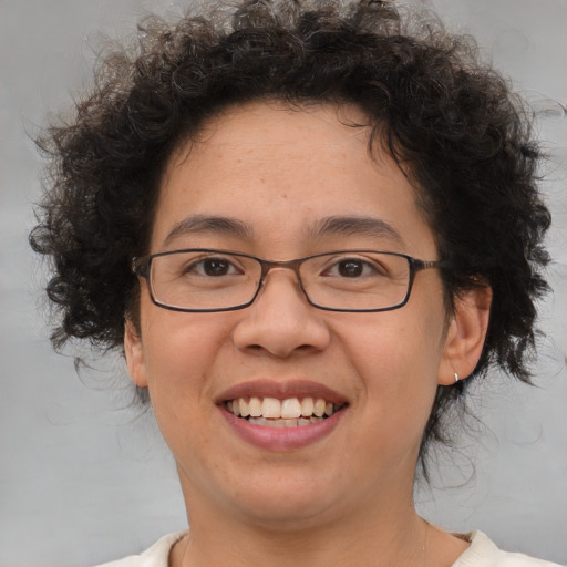 Joyful white adult female with short  brown hair and brown eyes