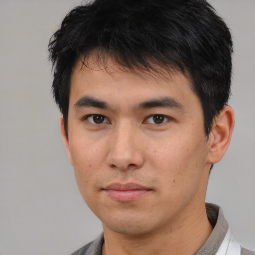 Neutral asian young-adult male with short  black hair and brown eyes