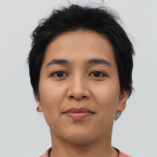 Joyful asian young-adult female with short  brown hair and brown eyes