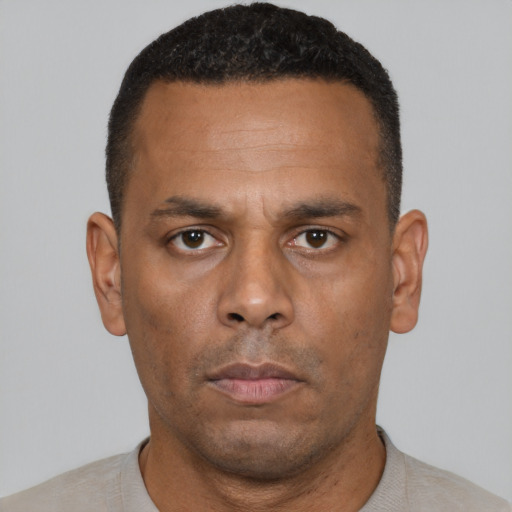 Neutral black young-adult male with short  brown hair and brown eyes
