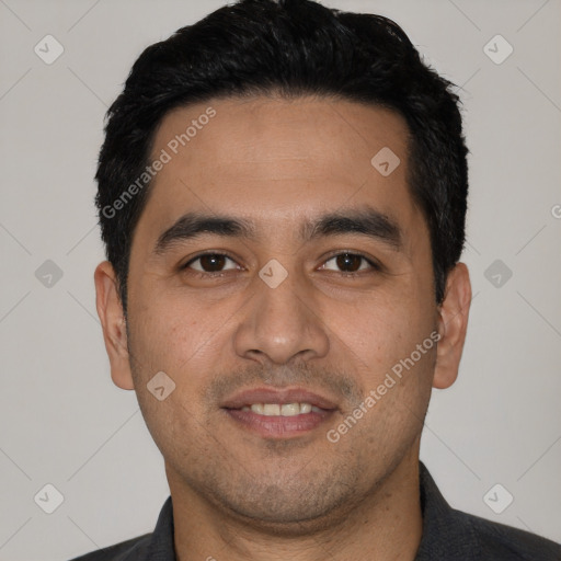 Joyful white young-adult male with short  black hair and brown eyes