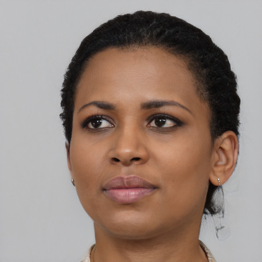Neutral black young-adult female with short  black hair and brown eyes
