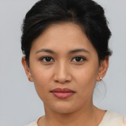 Joyful asian young-adult female with short  brown hair and brown eyes