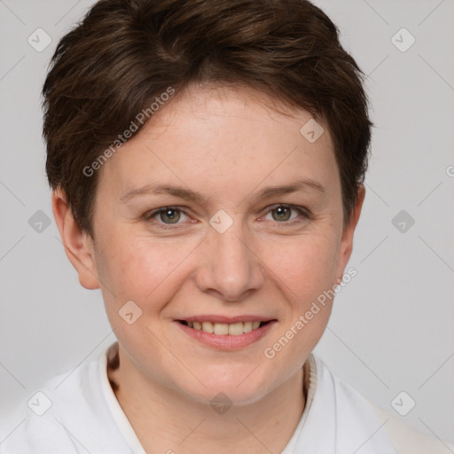 Joyful white young-adult female with short  brown hair and grey eyes