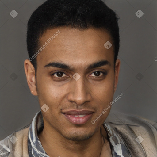 Joyful black young-adult male with short  black hair and brown eyes