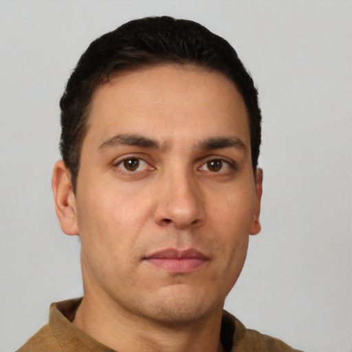 Neutral white young-adult male with short  black hair and brown eyes