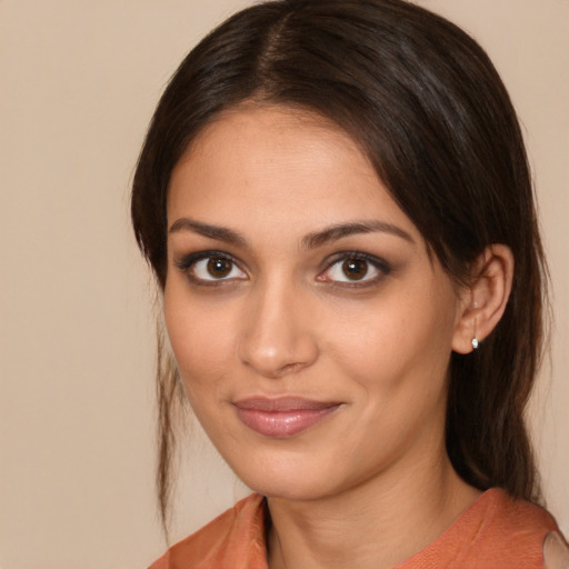 Joyful white young-adult female with medium  brown hair and brown eyes