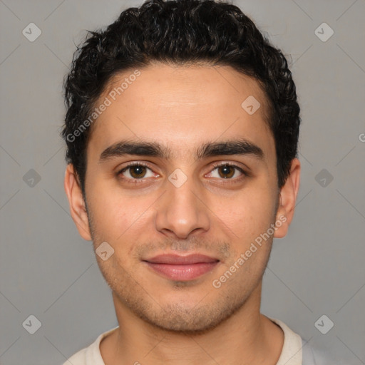 Joyful white young-adult male with short  black hair and brown eyes