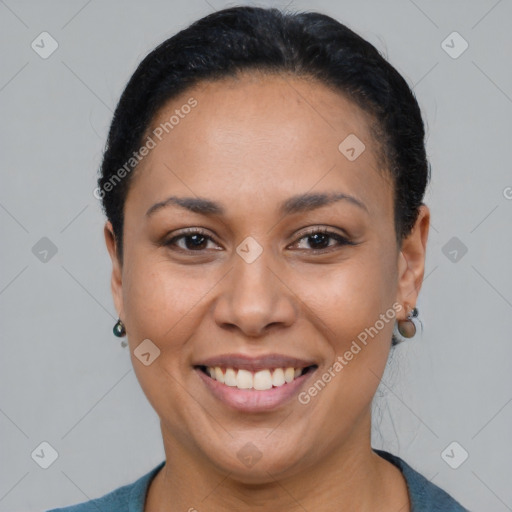 Joyful latino young-adult female with short  black hair and brown eyes