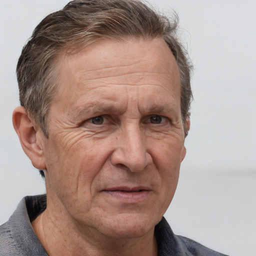 Joyful white middle-aged male with short  brown hair and grey eyes