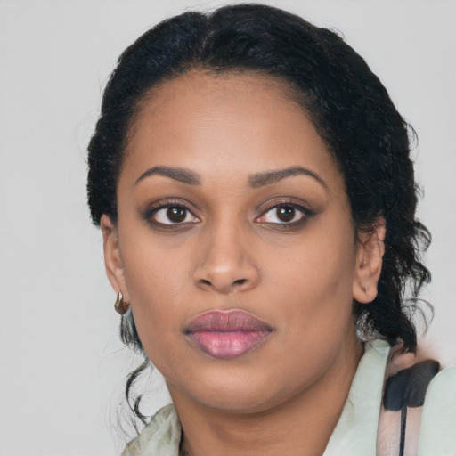 Joyful latino young-adult female with medium  black hair and brown eyes