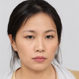 Neutral asian young-adult female with medium  brown hair and brown eyes