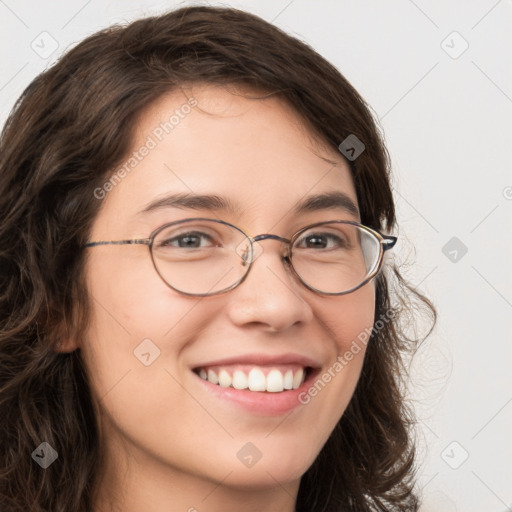 Joyful white young-adult female with long  brown hair and green eyes