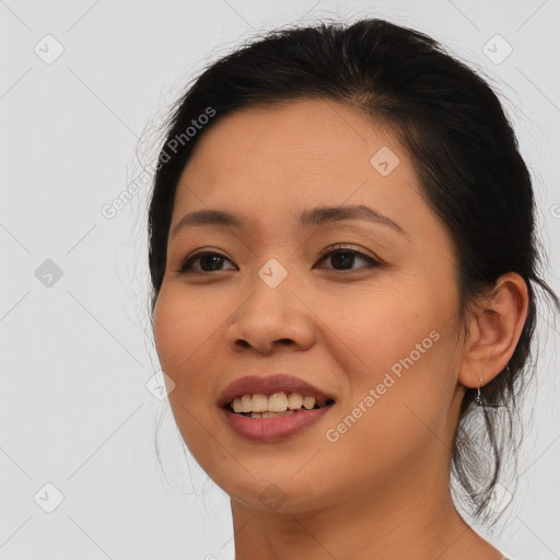 Joyful asian young-adult female with medium  brown hair and brown eyes