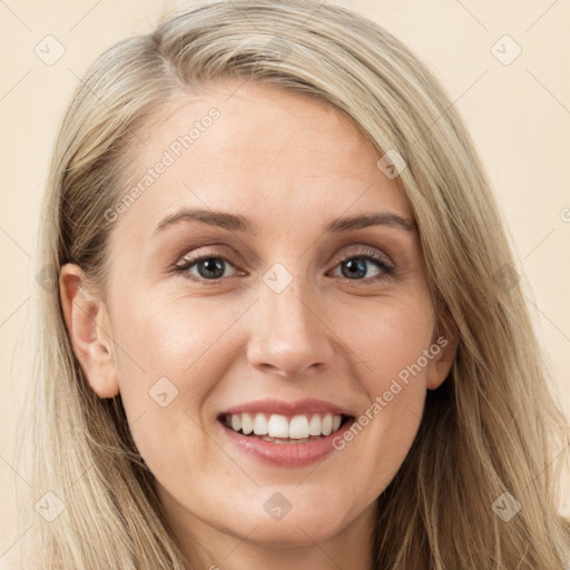 Joyful white young-adult female with long  brown hair and green eyes