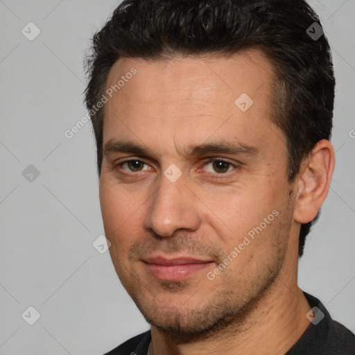 Joyful white adult male with short  brown hair and brown eyes