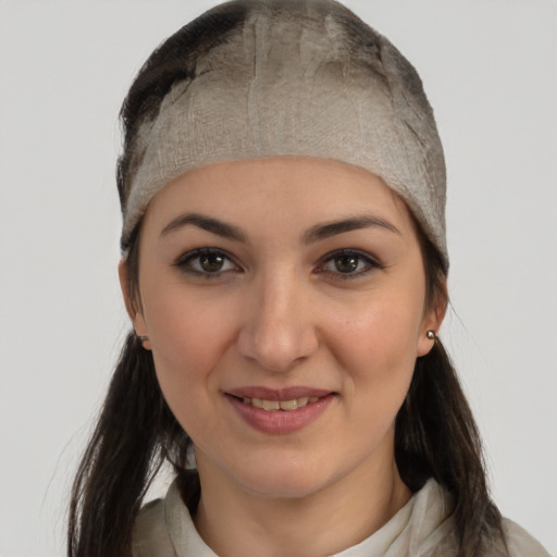 Joyful white young-adult female with medium  brown hair and brown eyes