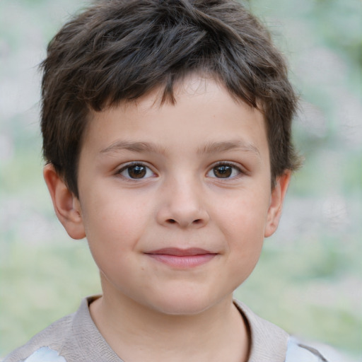 Joyful white child male with short  brown hair and brown eyes