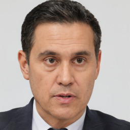 Neutral white adult male with short  black hair and brown eyes