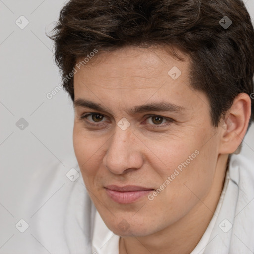 Joyful white adult male with short  brown hair and brown eyes