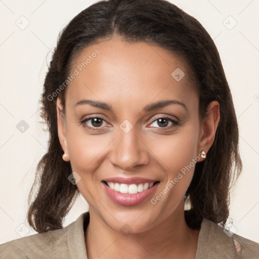 Joyful latino young-adult female with long  brown hair and brown eyes