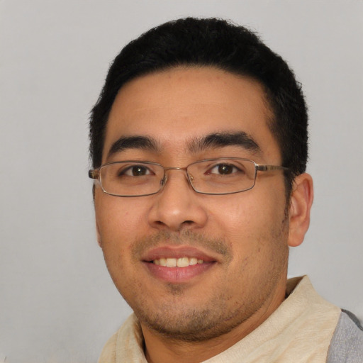 Joyful asian young-adult male with short  black hair and brown eyes