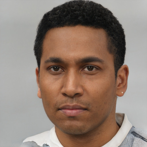 Neutral latino young-adult male with short  black hair and brown eyes