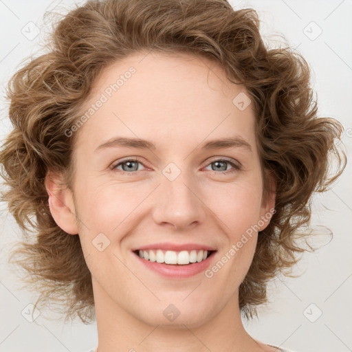 Joyful white young-adult female with medium  brown hair and green eyes