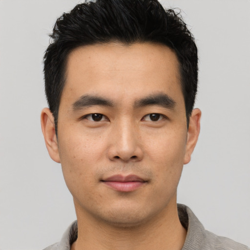 Neutral asian young-adult male with short  black hair and brown eyes