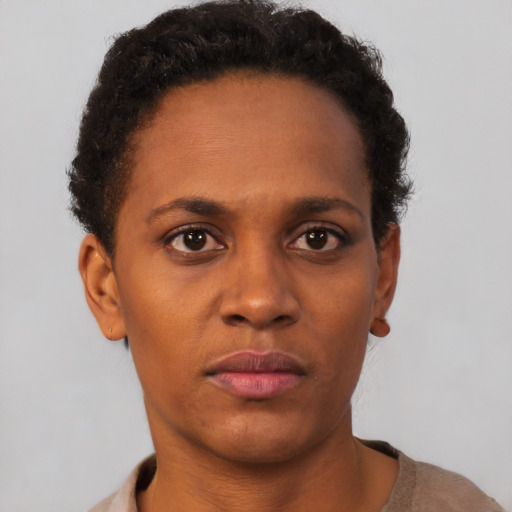 Neutral black young-adult female with short  brown hair and brown eyes