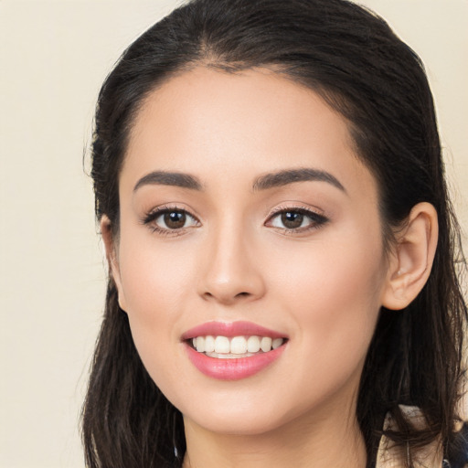 Joyful white young-adult female with long  brown hair and brown eyes