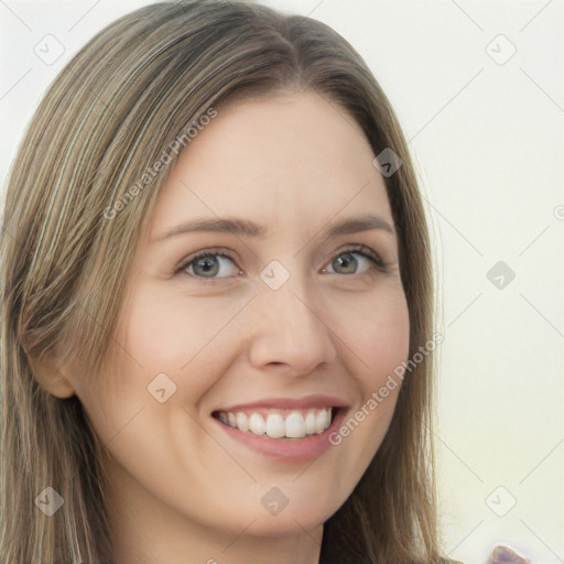 Joyful white young-adult female with long  brown hair and grey eyes