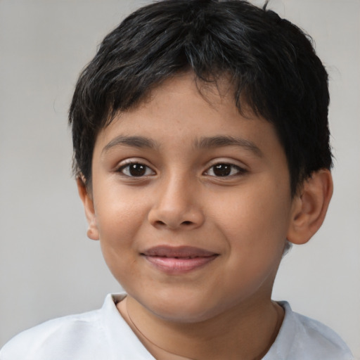 Joyful latino child female with short  brown hair and brown eyes